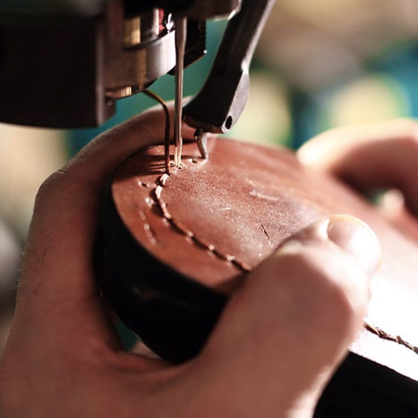 The heel of a shoe is being repaired